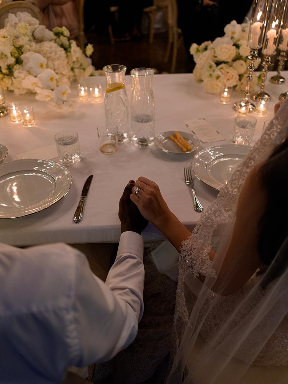 Bride and Groom Holding Hands at Lake Como Wedding Reception